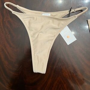 NWT bikini bottom tan, size small. Hygienic liner still on. Shade and Shore